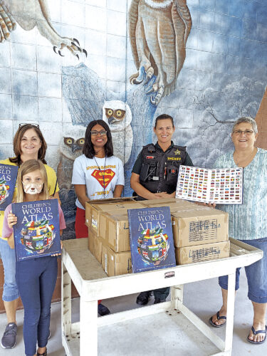 Kiwanis delivers world atlases to local students